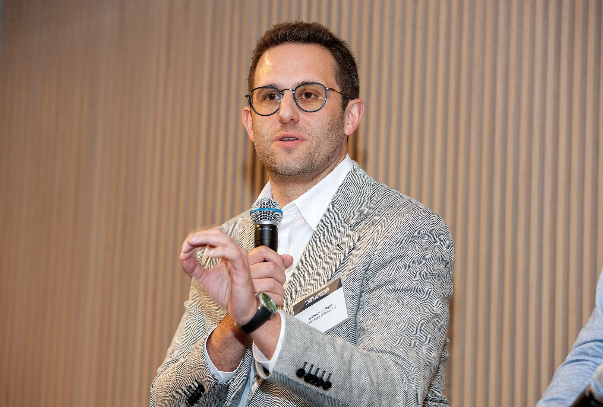 Brandon Singer speaks at the Commercial Observer Retail and Hospitality Forum.