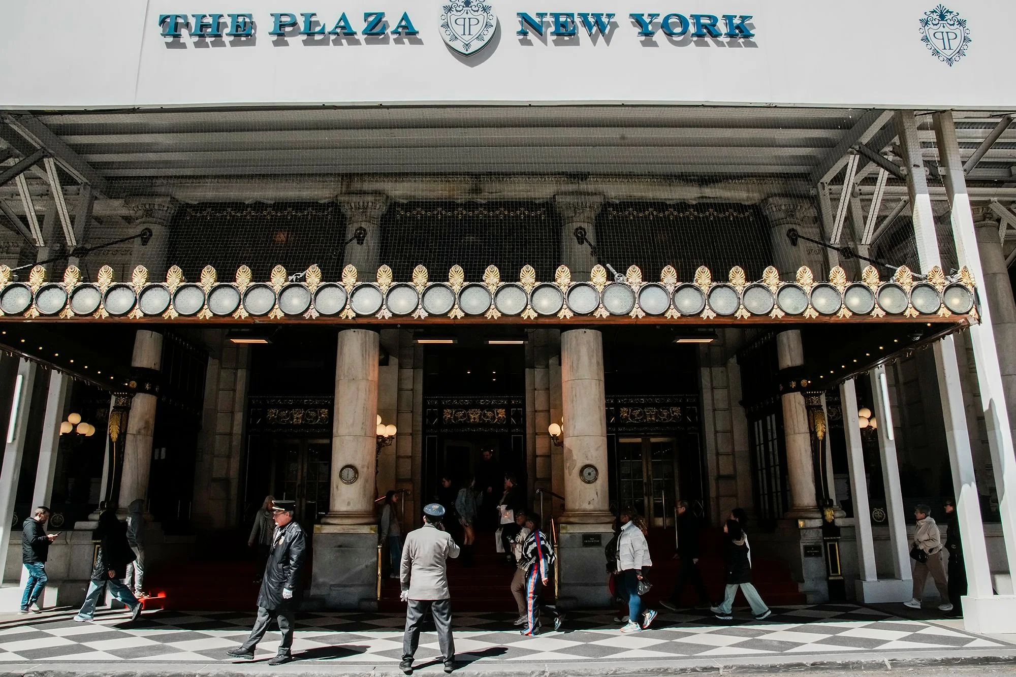 People walk in front of the Plaza hotel in April.